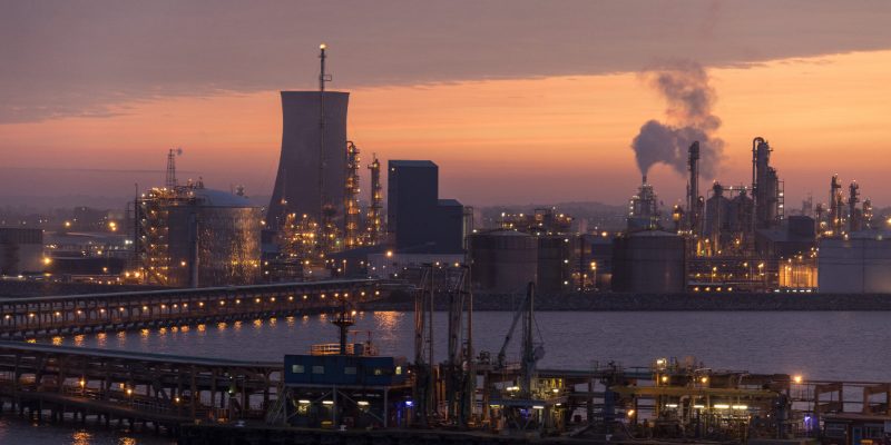 UK petrochemical complex at dusk — the kind of heavy-industry site Track 1 CCUS infrastructure is designed to decarbonise via the East Coast Cluster and HyNet networks.