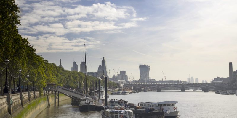 The River Thames at the Embankment with the City of London skyline beyond — the geography behind Thames Water's restructuring, the largest single financial event in the modern UK water sector.